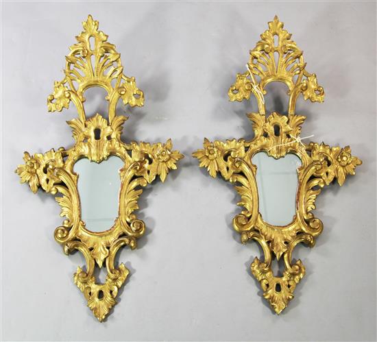 Pr of 20th century Italian carved giltwood cartouche shaped wall mirrors, 3ft 7in. x 2ft 1in.(-)